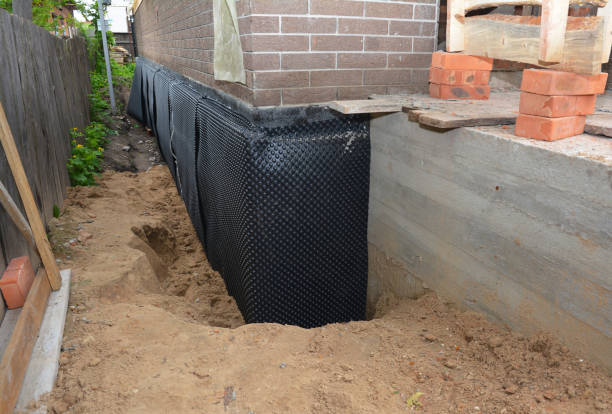 SJ Waterproofing Pros technician performing targeted Waterproofing assessment in Bentonville, OH